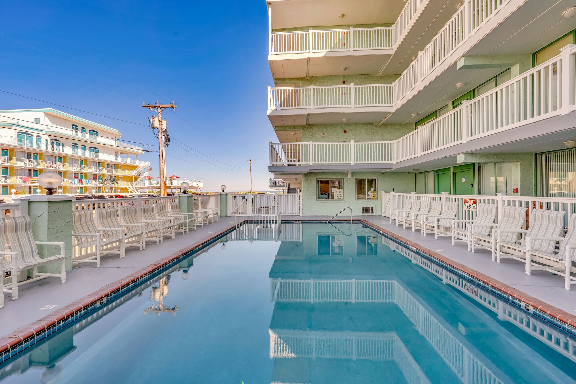 Four Winds pool with lounge chairs along the deck