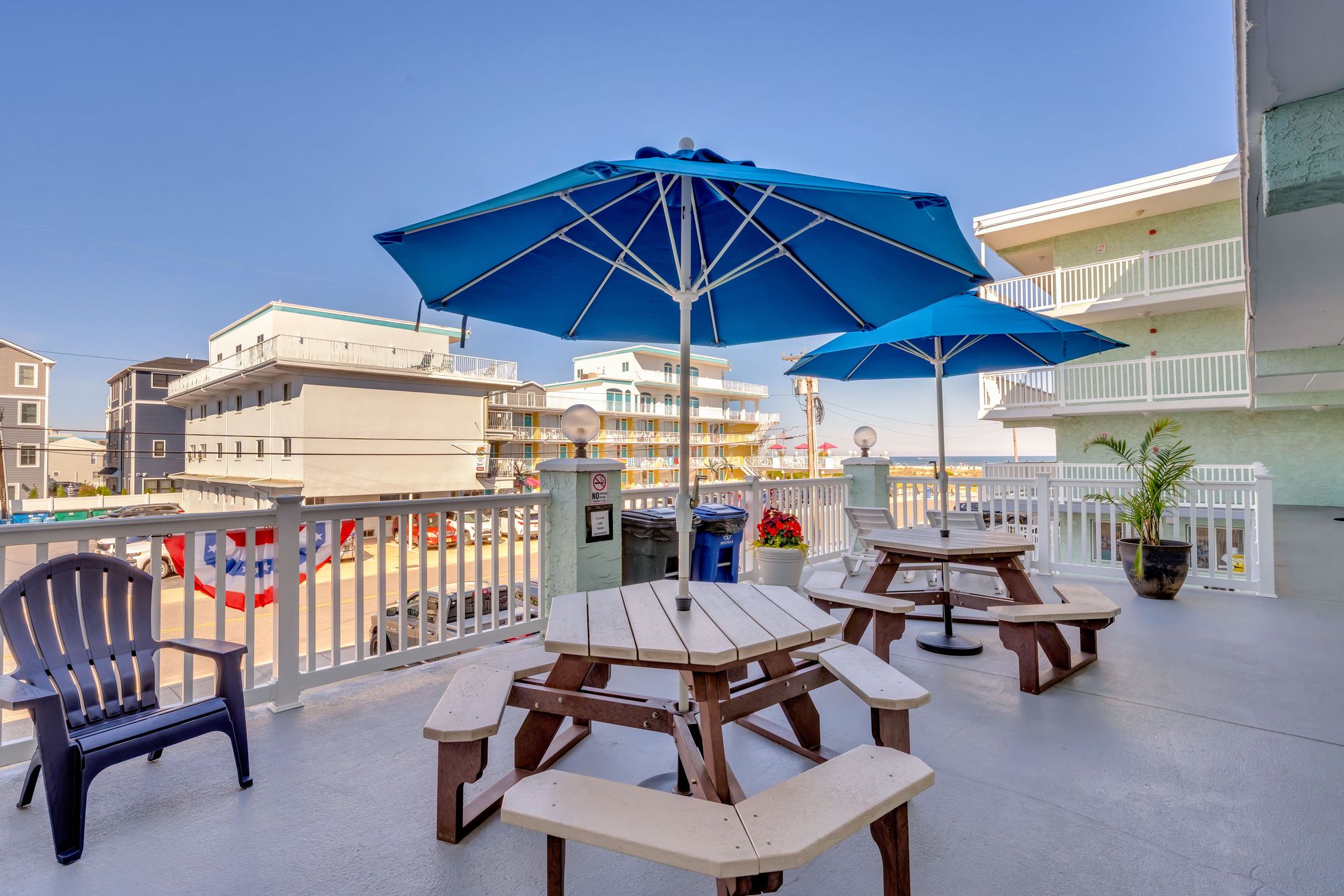 Four Winds sun deck with picnic tables and umbrellas